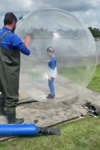 Zorbing {New} Getting in a zorbing ball