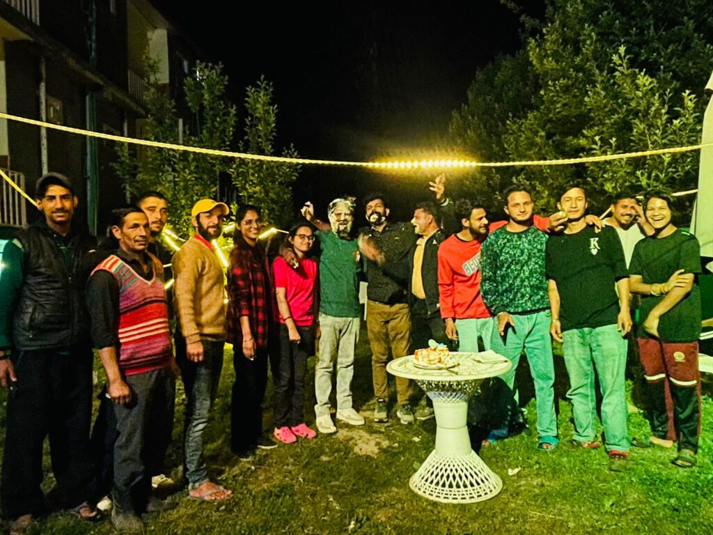 Journey of Himalaya travel group enjoying Himachal tour with mountains in background