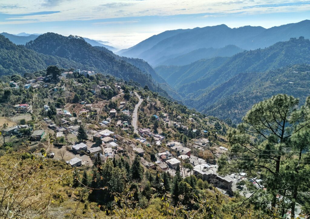 A scenic view of Shimla Ridge with colonial buildings and lush green hills